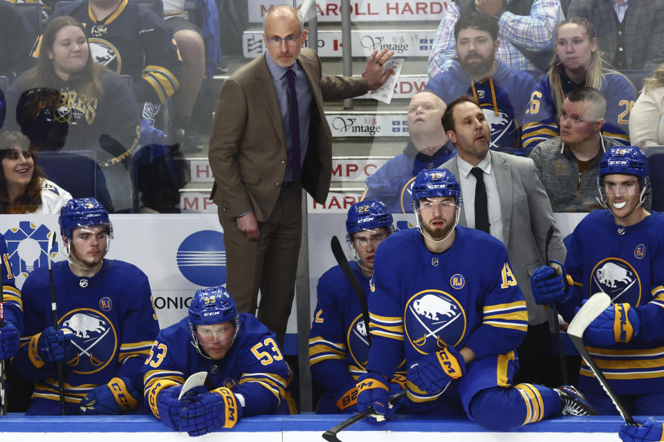 FILE - Buffalo Sabres head coach Don Granato, center top, looks on during the third period of an NHL hockey game against the Washington Capitals, Thursday, April 11, 2024, in Buffalo, N.Y. The Buffalo Sabres fired head coach Don Granato on Tuesday, April 16, making him the seventh coach to be ousted during what’s grown into an NHL-record 13-season playoff drought.(AP Photo/Jeffrey T. Barnes, File)