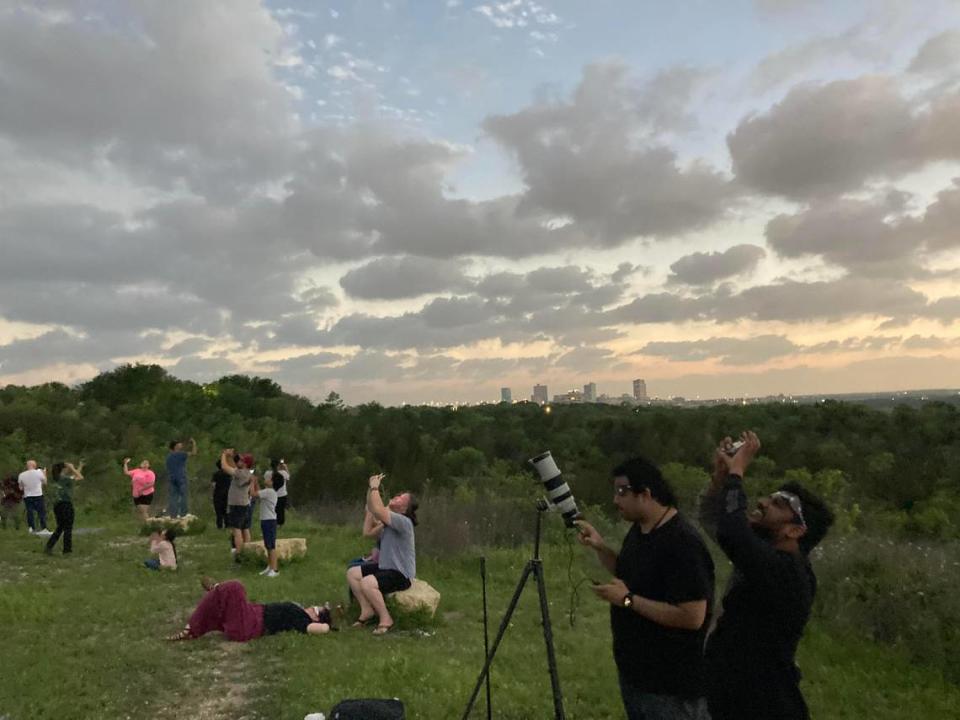 On Tandy Hill Natural Area in East Fort Worth, hundreds of people gathered to see the total solar eclipse on Monday. At 1:41 p.m., people enjoyed mother nature’s show, cool temperatures, and the lights all over downtown Fort Worth were aglow. Mac Engel/Fort Worth Star-Telegram