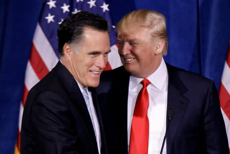 Donald Trump greets Mitt Romney during a news conference in Las Vegas, Feb. 2, 2012. (Photo: Julie Jacobson/AP)