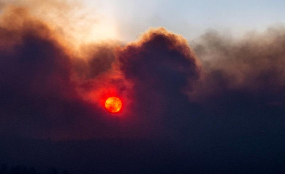 The sun rises as seen through smoke from the Park Fire as seen from Cohasset Road east of Chico on Thursday, July 25, 2024.