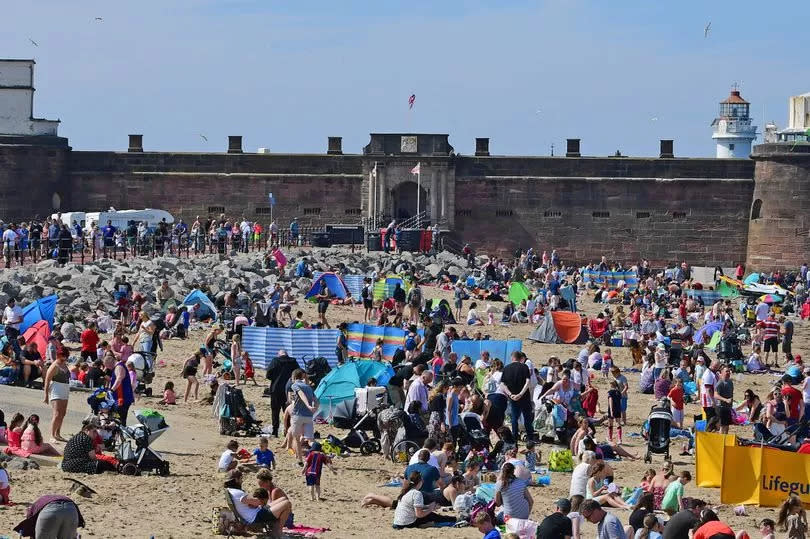 Bank Holiday Monday crowds on New Brighton beach, Wirral