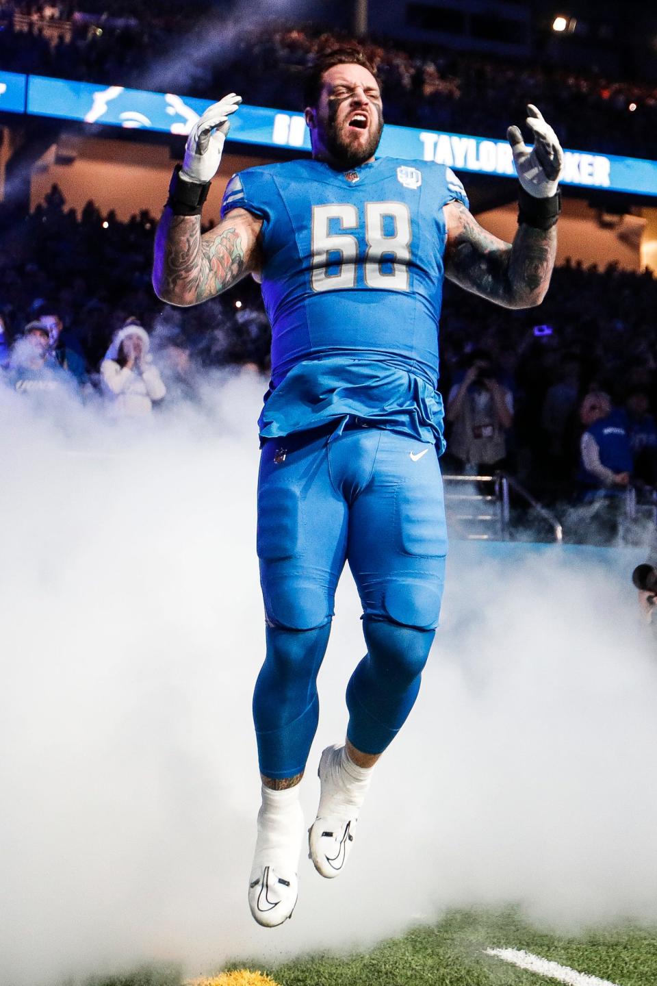 Detroit Lions left tackle Taylor Decker takes the field during player introductions for the game against the Denver Broncos at Ford Field in Detroit on Saturday, Dec. 16, 2023.