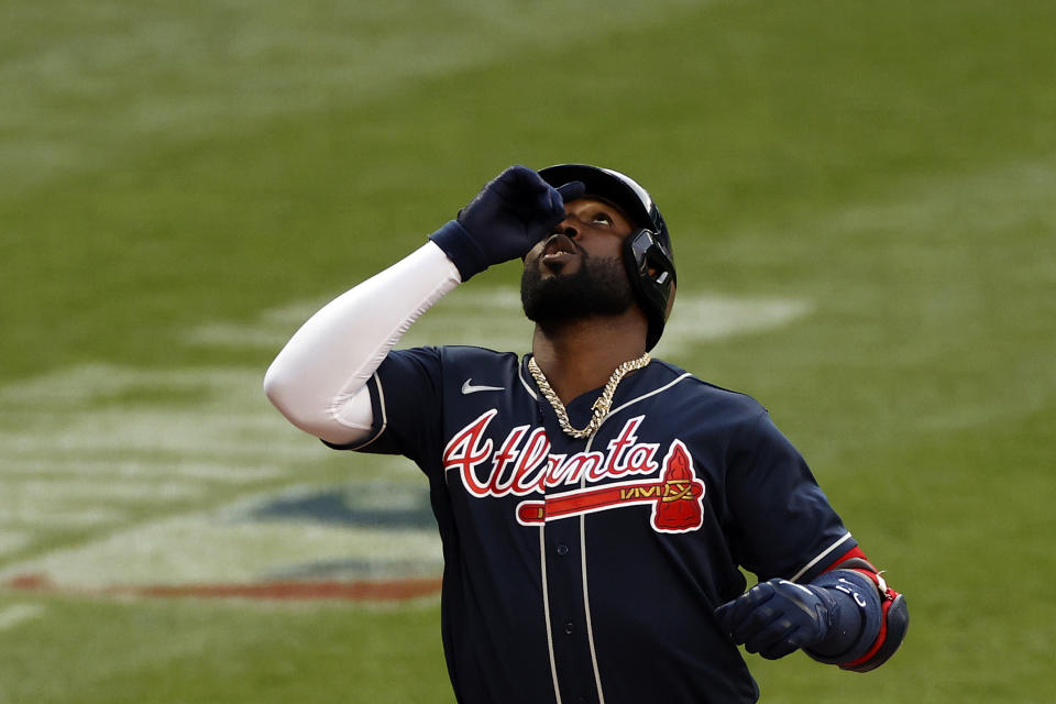 Atlanta Braves designated hitter Marcell Ozuna celebrates a solo home run against the New York Mets during the ninth inning of a baseball game Saturday, July 25, 2020, in New York. (AP Photo/Adam Hunger)