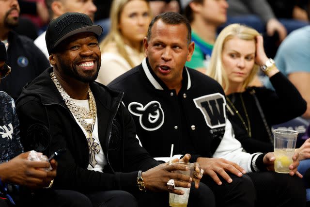 <p>David Berding/Getty</p> Alex Rodriguez and 50 Cent attend a Minnesota Timberwolves game on February 4, 2024