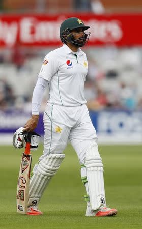 Britain Cricket - England v Pakistan - Second Test - Emirates Old Trafford - 25/7/16 Pakistan's Misbah-ul-Haq walks off dejected after losing his wicket Action Images via Reuters / Jason Cairnduff Livepic