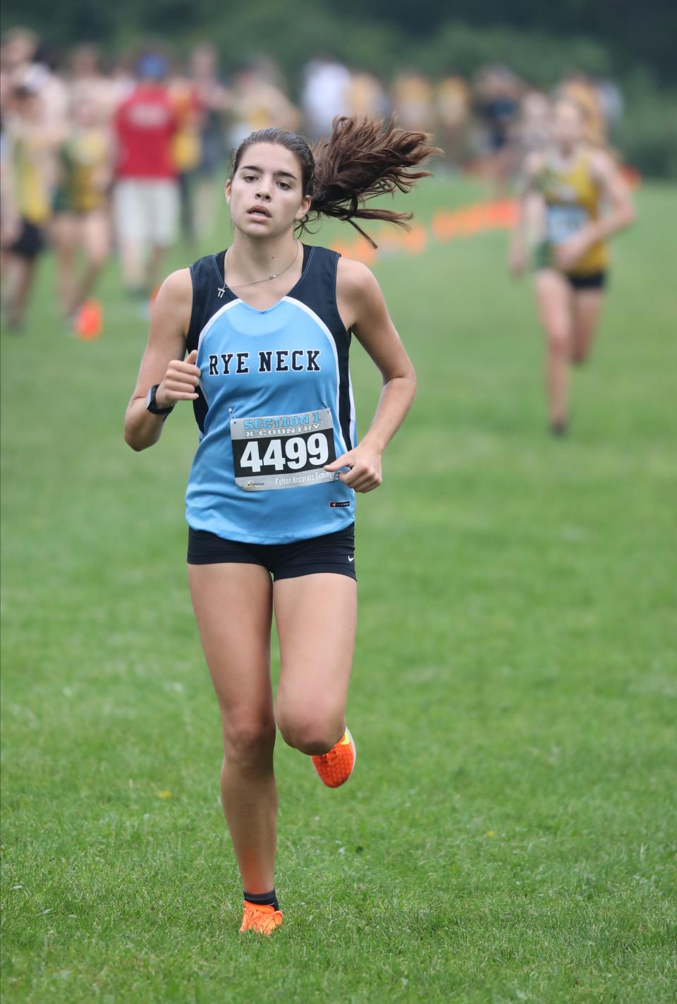Ainara Schube Barriola from Rye Neck crosses the finish line during the girls D3 race at the Somers Big Red Invitational Cross Country meet at Somers High School, Sept. 9, 2023.
