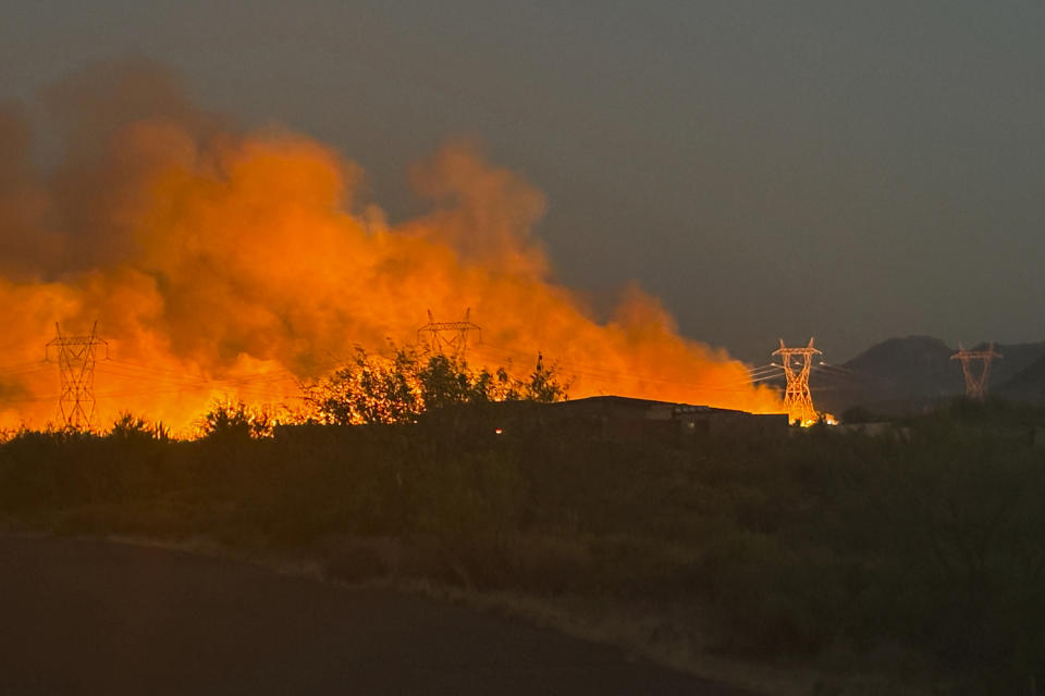 This photo released by the Arizona Department of Forestry and Fire Management shows smoke rising from the Boulder View fire Thursday, June 27, 2024, near Phoenix. Air tankers and helicopters have joined nearly 200 firefighters battling a wildfire northeast of Phoenix that has forced dozens of residents to flee their homes. (Tiffany Davila/Arizona Department of Forestry and Fire Management via AP)