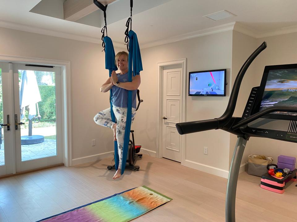 Carol Zurcher expanded and updated her home gym during COVID by adding a high-tech NordicTrack and aerial yoga hammock. Given the equipment, technology, and convenience, she says she can’t ever see herself going to back to an outside gym.