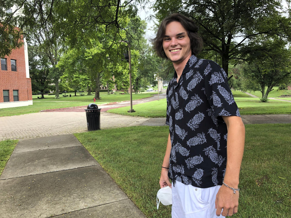 College Freshman Nicholas Cecil poses for a photo on the campus of West Virginia State University in Institute, W.Va., during move-in day Friday, July 31, 2020. Cecil missed his high school prom and senior season of baseball, both called off due to the coronavirus pandemic. He said Friday marked the start of "a new chapter in my life." (AP Photo/John Raby)