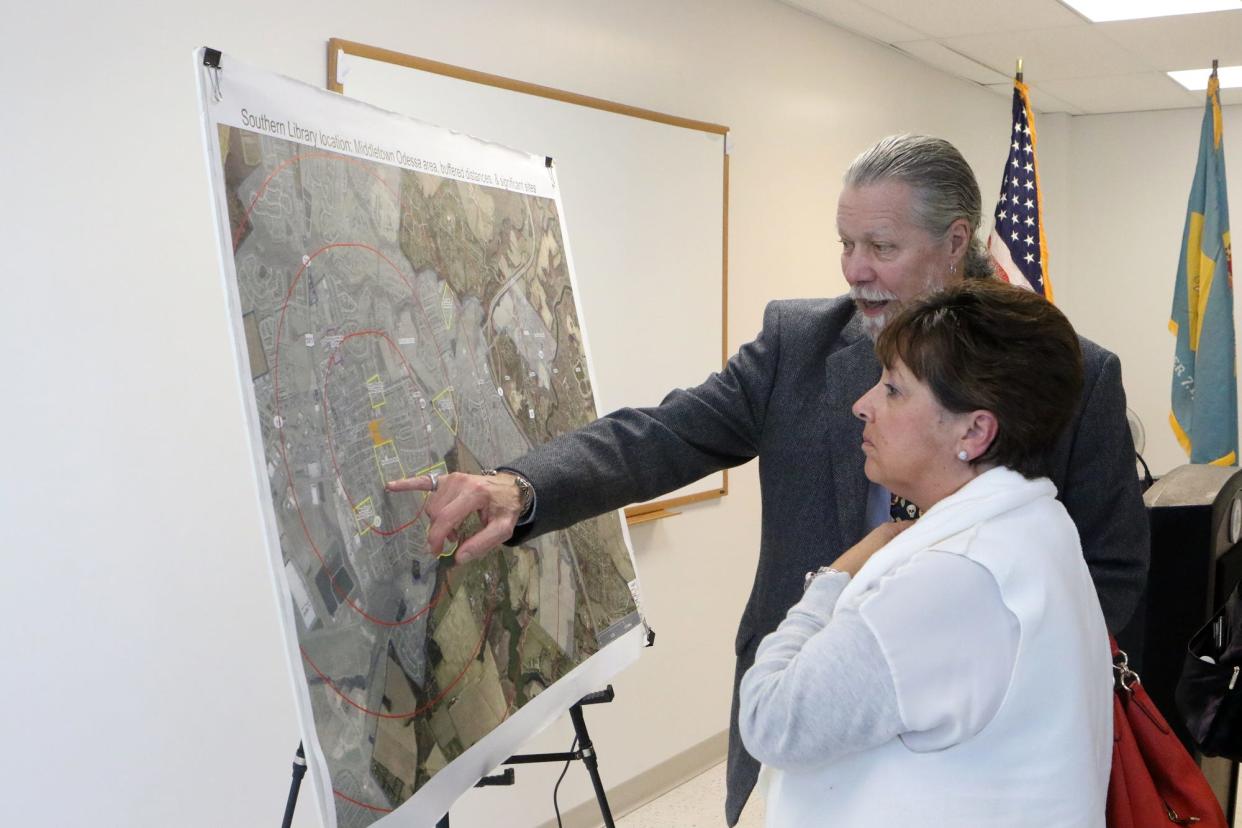 Administrative Librarian John Phillos shows Kathy Knotts of Buck Simpers Artchitects & Associates, Inc., where the new New Castle County Southern Library will be located. Land has been purchased for the library to be built on a portion of the Promenade property on Main and Catherine streets in Middletown.