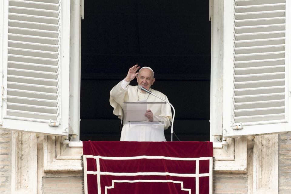 Pope Francis waves as he leaves after the Angelus noon prayer from the window of his studio overlooking St.Peter's Square, at the Vatican, Sunday, Oct. 3, 2021. (AP Photo/Alessandra Tarantino)