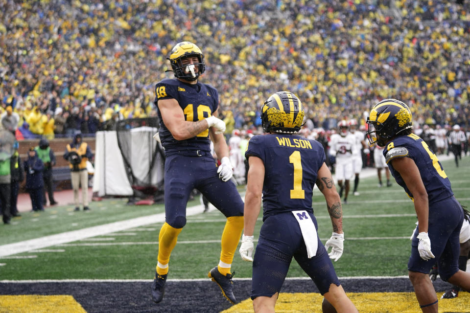 Michigan tight end Colston Loveland (18) celebrates his touchdown catch against Indiana in the second half of an NCAA college football game in Ann Arbor, Mich., Saturday, Oct. 14, 2023. (AP Photo/Paul Sancya)