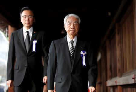 Japan's ruling Liberal Democratic Party (LDP) lawmaker Hidehisa Otsuji (R) makes his way after paying his respects at the Yasukuni Shrine in Tokyo, Japan, October 18, 2016. REUTERS/Kim Kyung-Hoon