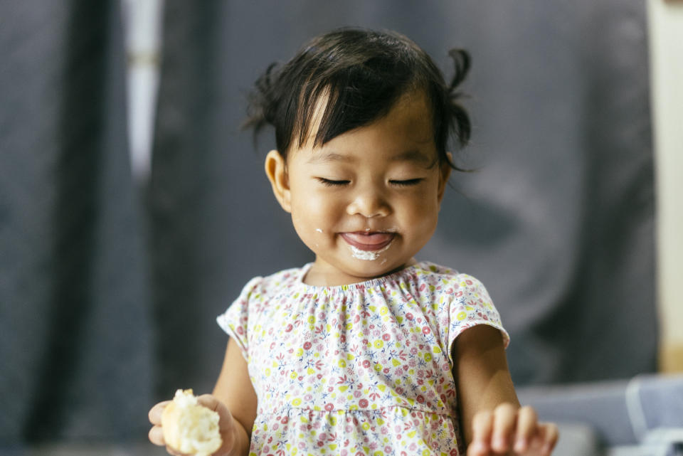 baby with food on her face