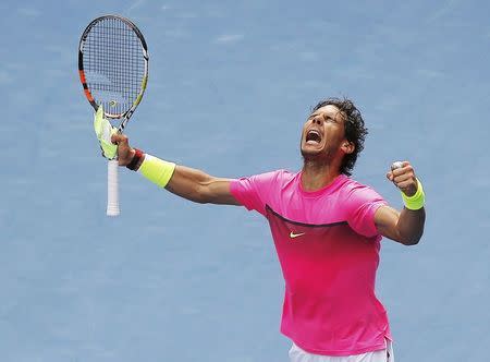 Rafael Nadal of Spain celebrates defeating Kevin Anderson of South Africa to win their men's singles fourth round match at the Australian Open 2015 tennis tournament in Melbourne January 25, 2015. REUTERS/Carlos Barria