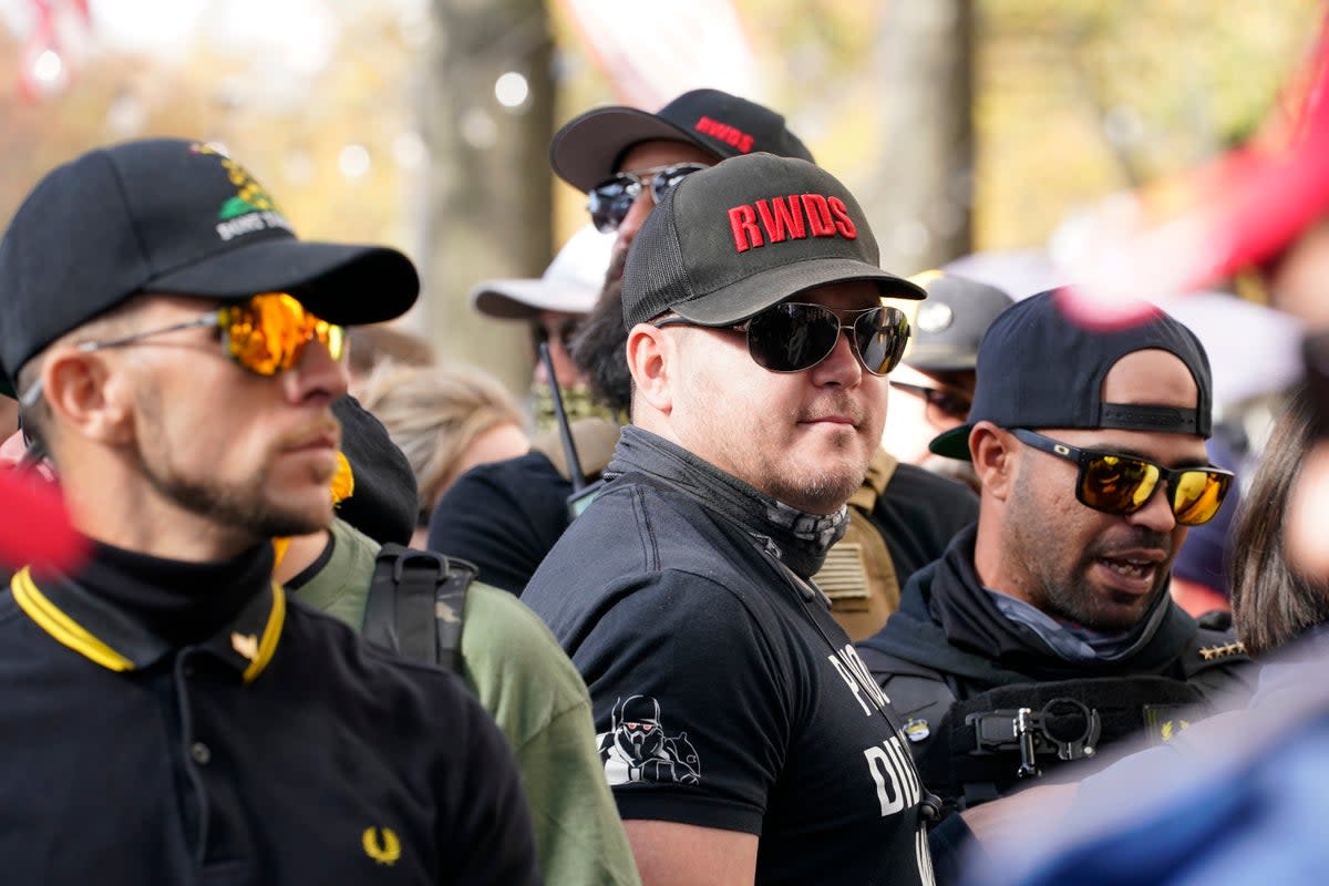Members of the Proud Boys are photographed with “RWDS” on their hats in 2020. (AP)