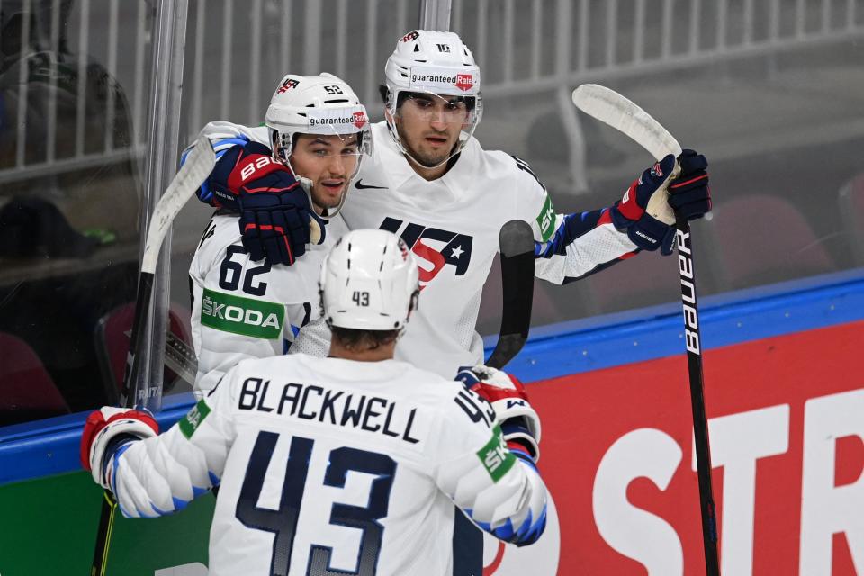 Matthew Beniers, right, congratulates Kevin Labanc, left, during the world championships. Beniers is expected to be selected No. 2 overall in the 2021 NHL draft.