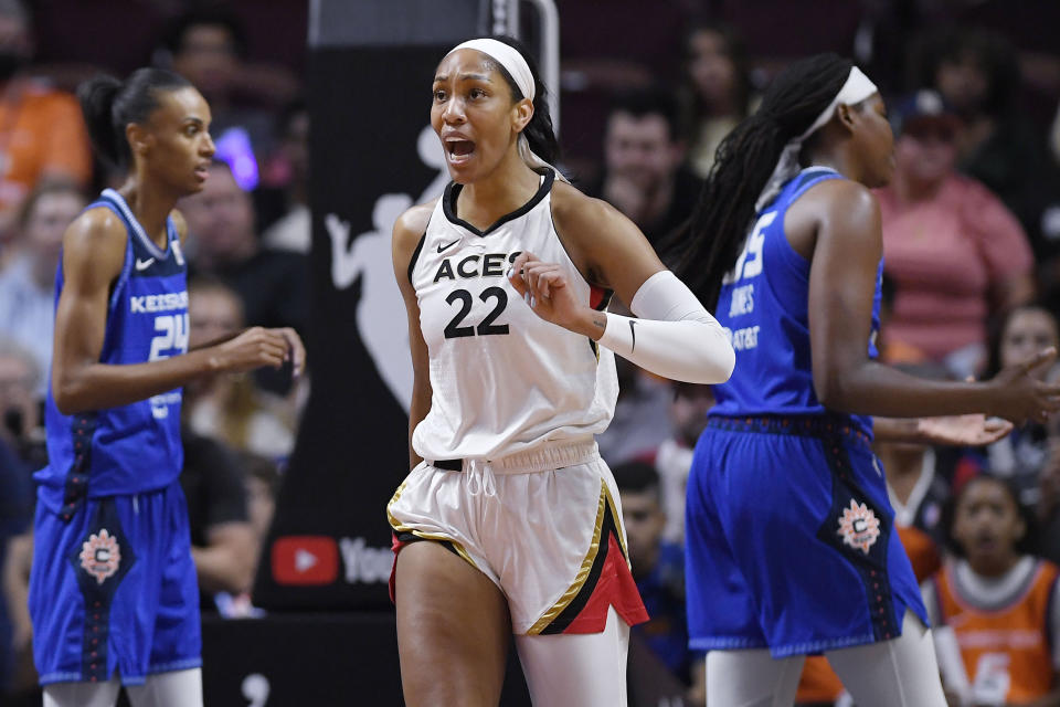 Las Vegas Aces' A'ja Wilson (22) reacts after she was fouled during the first half in Game 4 of a WNBA basketball final playoff series against the Connecticut Sun, Sunday, Sept. 18, 2022, in Uncasville, Conn. (AP Photo/Jessica Hill)