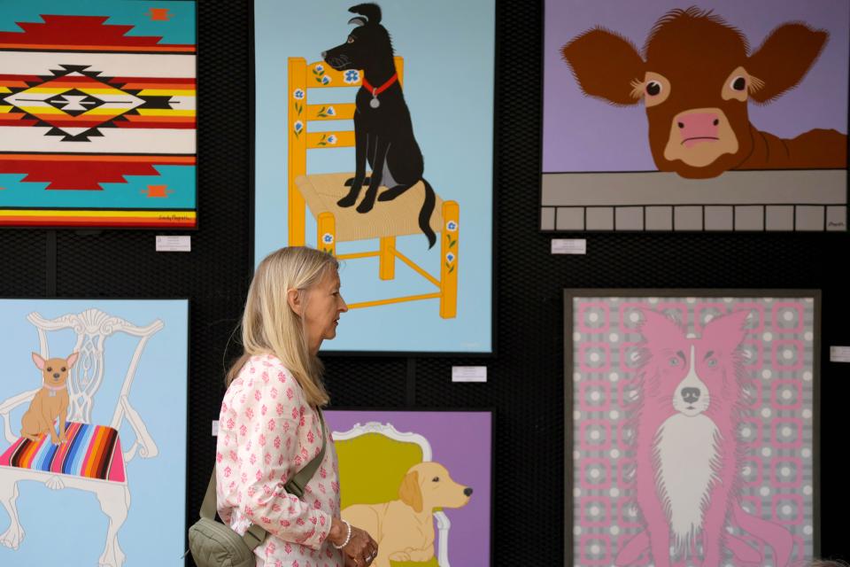 Artist Sandy Magrath stands at her tent during the Festival of the Arts in Oklahoma City, Saturday, April 27, 2024.