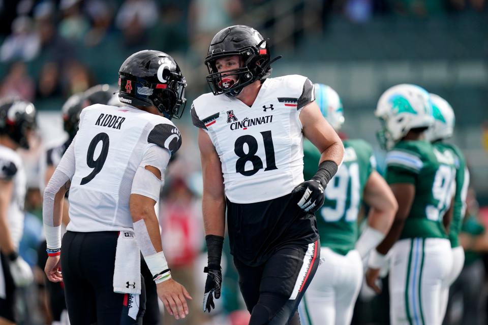 Cincinnati tight end Josh Whyle (81), shown here celebrating one of his touchdown catches with quarterback Desmond Ridder (9) in last season's win at Tulane, is coming off a seven-reception, 70-yard effort at Temple. Whyle had four caches for 79 yards against the Green Wave a season ago.