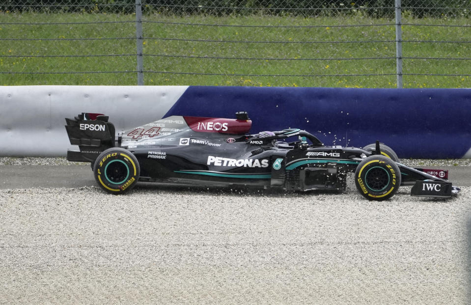 Mercedes driver Lewis Hamilton of Britain goes into the gravel at Turn Four during the second free practice session for the Austrian Formula One Grand Prix at the Red Bull Ring racetrack in Spielberg, Austria, Friday, July 2, 2021. The Austrian Grand Prix will be held on Sunday. (AP Photo/Darko Bandic)