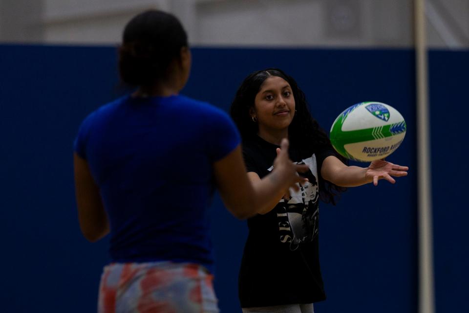 Sophia Zambrano, 12, passes the ball while running during a rugby clinic hosted by the Rockford Ravens Rugby Football Club on Wednesday, March 13, 2024, at the UW Health Sports Factory.