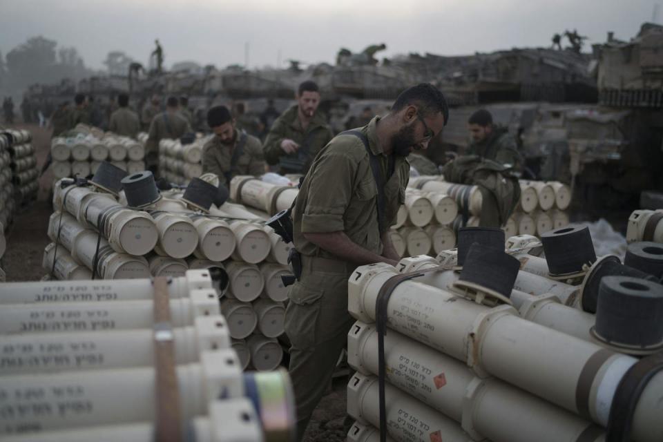 Israeli troops store tank shells near the Israel-Gaza border. <a href="https://newsroom.ap.org/detail/IsraelPalestinians/33027649211441e5a28d452de8a4c25f/photo" rel="nofollow noopener" target="_blank" data-ylk="slk:AP Photo/Leo Correa;elm:context_link;itc:0;sec:content-canvas" class="link ">AP Photo/Leo Correa</a>