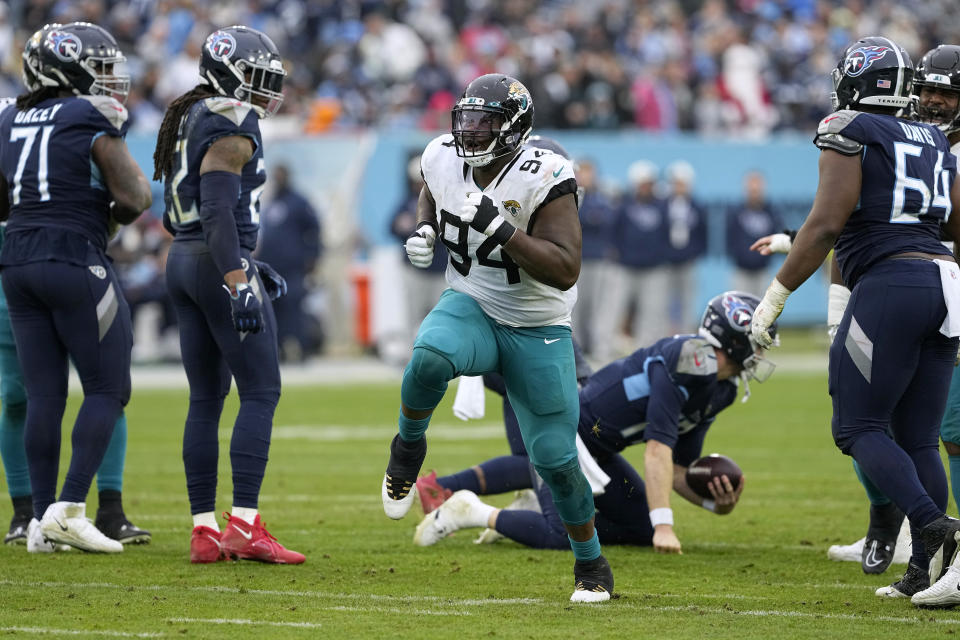 Jacksonville Jaguars defensive tackle Folorunso Fatukasi (94) celebrates a sack of Tennessee Titans quarterback Ryan Tannehill during the second half of an NFL football game Sunday, Dec. 11, 2022, in Nashville, Tenn. (AP Photo/Chris Carlson)