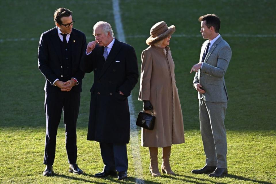 britains king charles iii 2l and britains camilla, queen consort 2r talk with wrexham afc co chairman, us actor ryan reynolds l and us actor rob mcelhenney during their visit to wrexham association football club in north wales on december 9, 2022 photo by oli scarff  afp photo by oli scarffafp via getty images