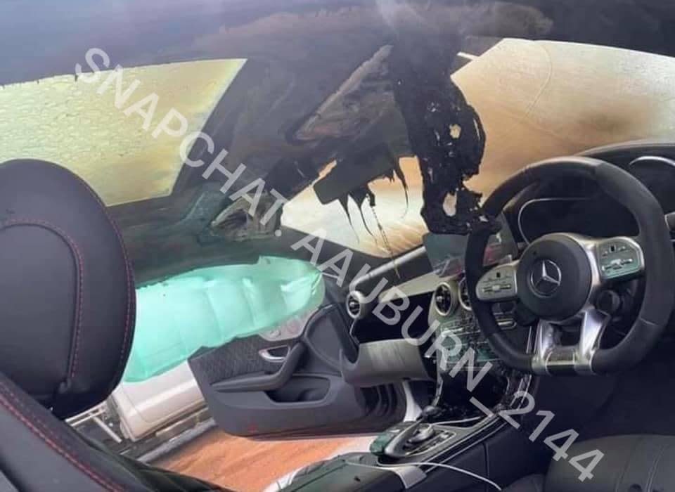 A Mercedes Benz AMG C63S coupe is seen from the inside completely destroyed by fire.