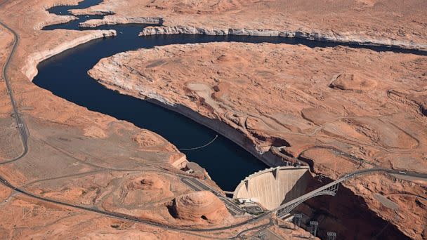 PHOTO: Glen Canyon Dam holds back Colorado River water to create Lake Powell on April 15, 2023 in Lake Page, Ariz. (RJ Sangosti/MediaNews Group/The Denver Post via Getty Images)