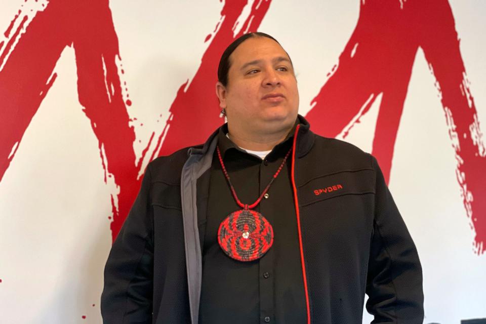 NDN Collective founder and CEO Nick Tilsen stands in the organization's headquarters in Rapid City, S.D., on Feb. 10, 2023. Tilsen traces the roots of his activism to Wounded Knee.
His parents, JoAnn Tall and Mark Tilsen, met at there, and he praises the women of the movement who sustained the traditional matriarchal system during the occupation. (Kalle Benallie/Indian Country Today via AP)