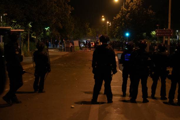 French riot police stand in line during protests in Nanterre, west of Paris, on 28 June 2023, a day after a 17-year-old boy was shot in the chest by police at point-blank range in Nanterre, a western suburb of Paris (AFP via Getty Images)