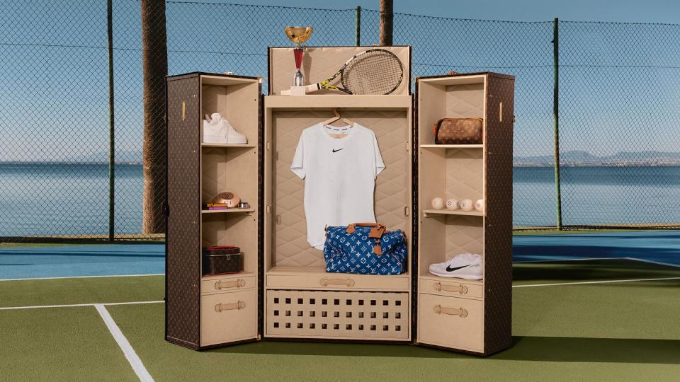 a room with a rack of clothes and a tennis racket