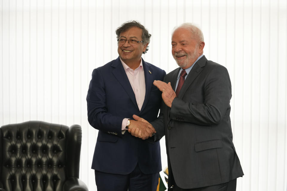 Brazilian President Luiz Inacio Lula da Silva, right, shakes hands with Colombia's President Gustavo Petro during a bilateral meeting at Itamaraty Palace, the day after Lula's inauguration in Brasilia, Brazil, Monday, Jan. 2, 2023. (AP Photo/Eraldo Peres)