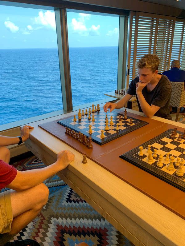 Passengers relax on board the Holland America-operated Westerdam cruise ship