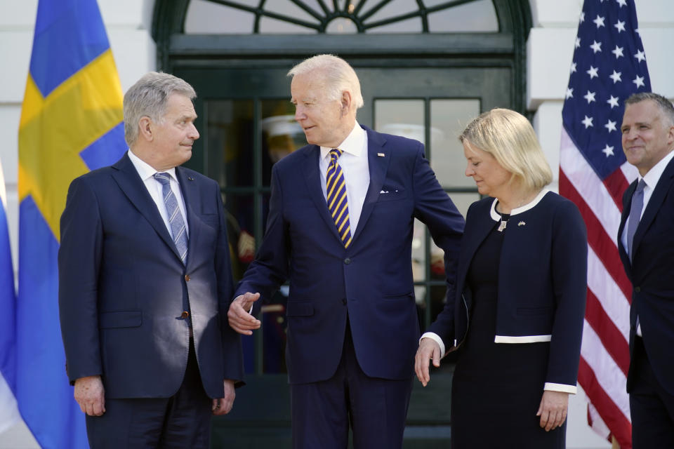 President Joe Biden greets Prime Minister Magdalena Andersson of Sweden and President Sauli Niinisto of Finland as they arrive at the White House in Washington, Thursday, May 19, 2022. (AP Photo/Andrew Harnik)
