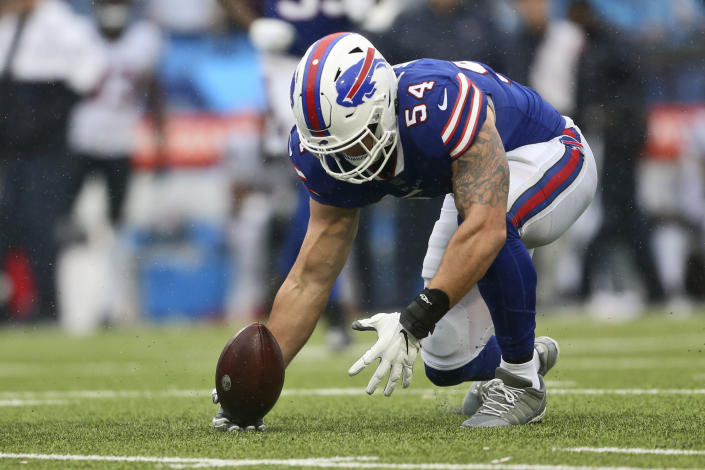 Buffalo Bills outside linebacker A.J. Klein picks up a fumble by the Houston Texans during the second half of an NFL football game, Sunday, Oct. 3, 2021, in Orchard Park, N.Y. (AP Photo/Joshua Bessex)