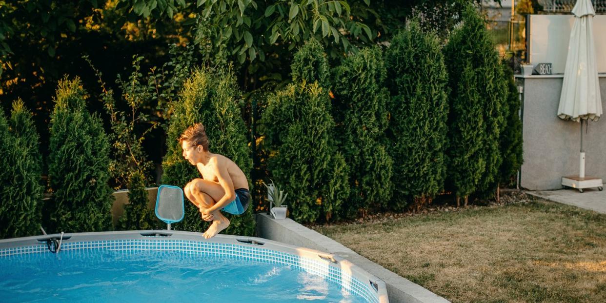 kids playing in home swimming pool