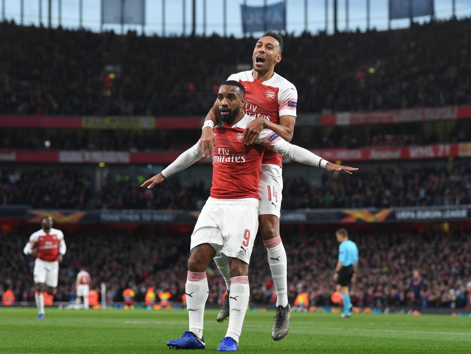 Alex Lacazette celebrates with Pierre-Emerick Aubameyang (Photo by Stuart MacFarlane/Arsenal FC via Getty Images)