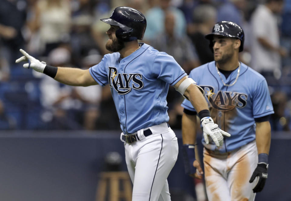 Tampa Bay Rays' Evan Longoria, left, celebrates with Kevin Kiermaier after hitting a two-run home run off New York Yankees starting pitcher Masahiro Tanaka during the second inning of a baseball game Sunday, April 2, 2017, in St. Petersburg, Fla. (AP Photo/Chris O'Meara)