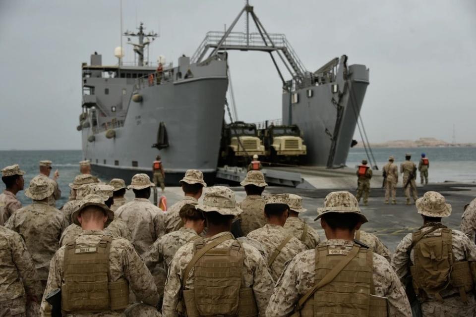 Logistics support vessel USAV SP4 James A. Loux (LSV-6) prepares to unload vehicles onto the trident pier
