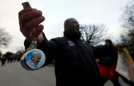 A street vendor sells gadgets depicting Pope Francis before his arrival in Pietrelcina, Italy March 17 2018. REUTERS/Ciro De Luca