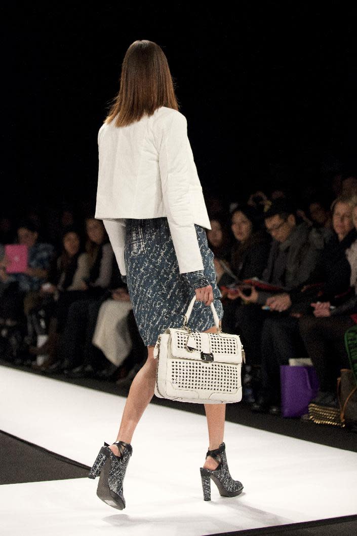A model walks the runway during the Rebecca Minkoff Fall 2013 fashion show during Fashion Week, Friday, Feb. 8, 2013, in New York. (AP Photo/Karly Domb Sadof)