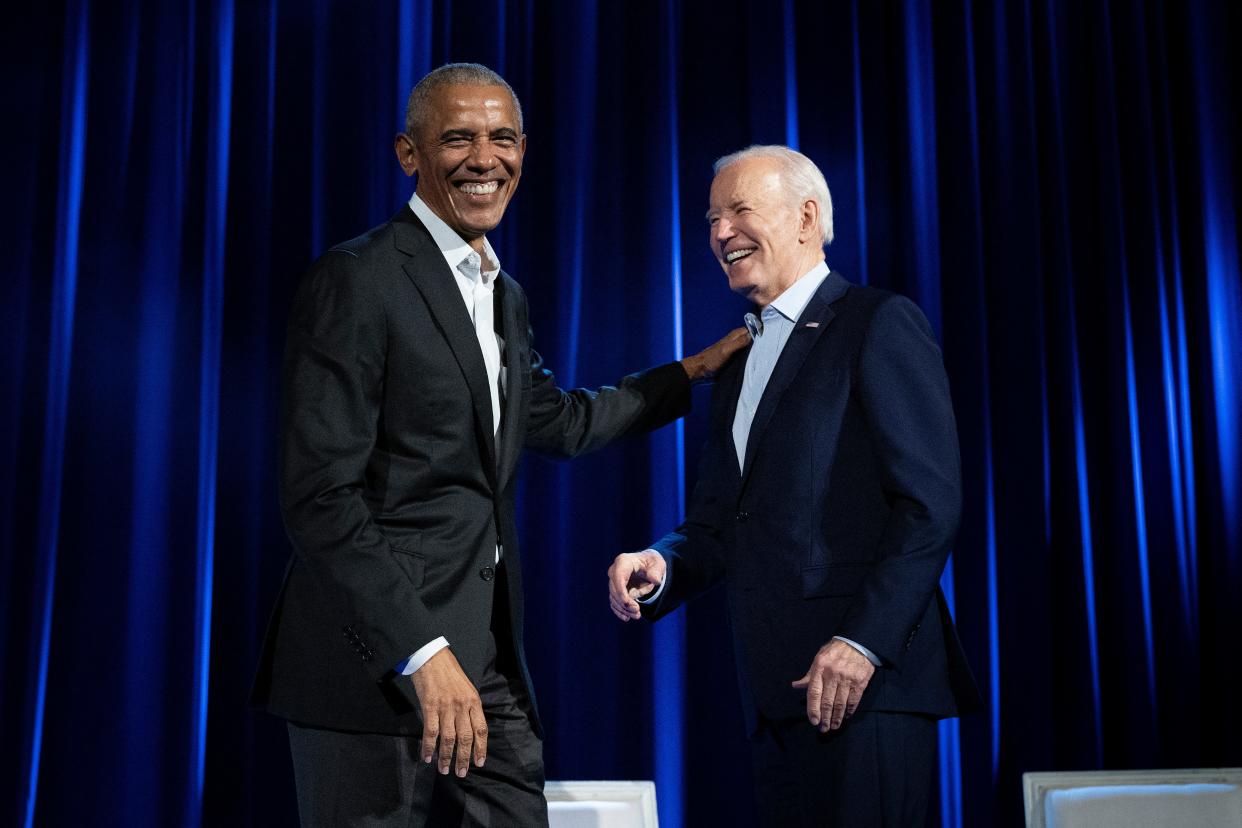 President Barack Obama (L) and US President Joe Biden arrive for a campaign fundraising event at Radio City Music Hall in New York City on March 28, 2024.