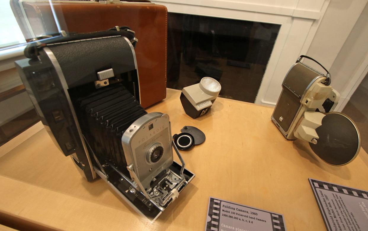 Film cameras on display at the new Into the Darkroom photography exhibit at the Gaston County Museum in Dallas Thursday afternoon, June 2, 2022.