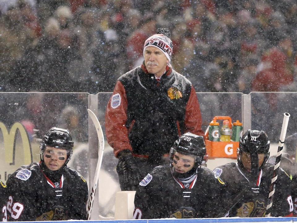 Chicago Blackhawks coach Joel Quenneville watches his team skate again the Pittsburgh Penguins during the first period of an NHL Stadium Series hockey game at Soldier Field on Saturday, March 1, 2014, in Chicago. (AP Photo/Charles Rex Arbogast)