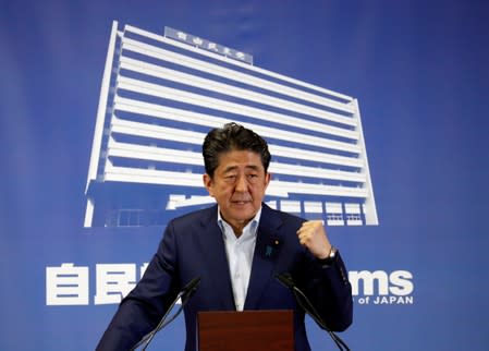 Japan's Prime Minister Shinzo Abe, who is also leader of the Liberal Democratic Party, attends a news conference a day after an upper house election at LDP headquarters in Tokyo