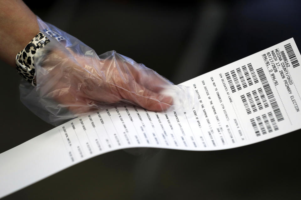 A person wears protective gloves during early voting for the Ohio primary election at the board of elections in Medina, Ohio, U.S. March 16, 2020. (Aaron Josefczyk/Reuters)