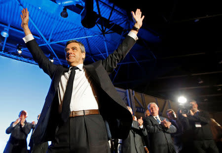 Francois Fillon, former French Prime Minister, member of the Republicans political party and 2017 French presidential election candidate of the French centre-right, salutes supporters during a political rally in Marseille, France, April 11, 2017. REUTERS/Jean-Paul Pelissier